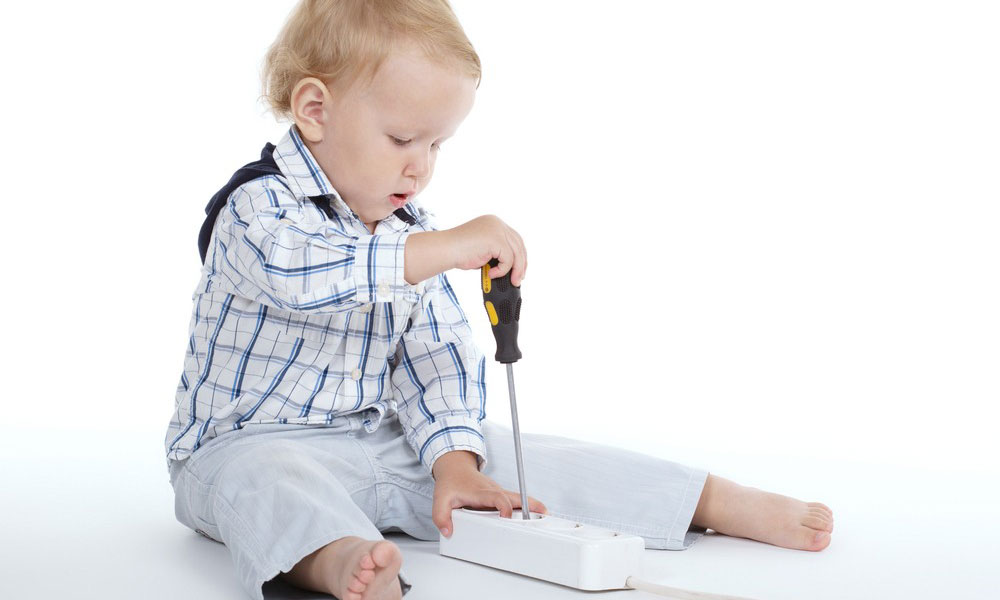 Baby with a screwdriver in a power board | Dawson Electric