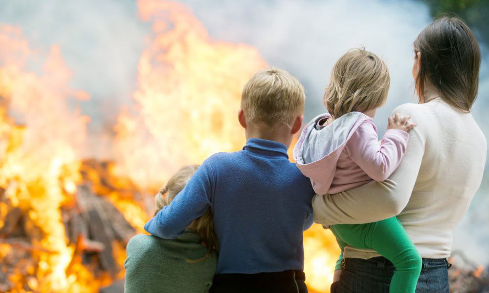 A mother with three young kids watching a house burn down | Dawson Electric