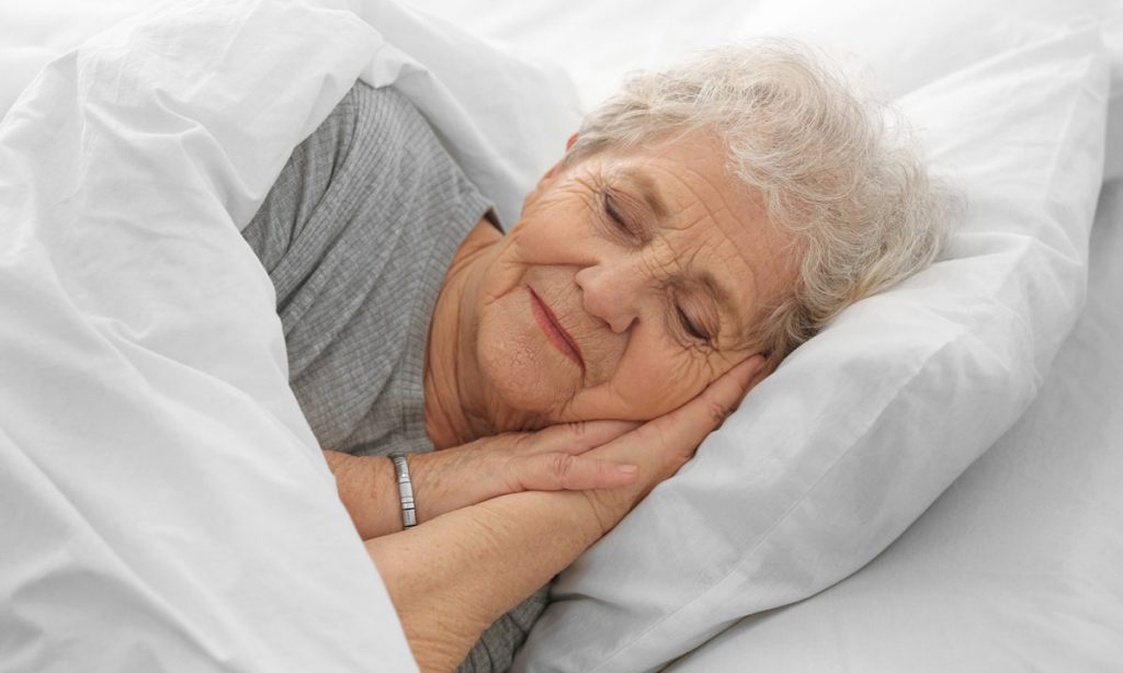 Elderly lady sleeping in bed | Dawson Electric